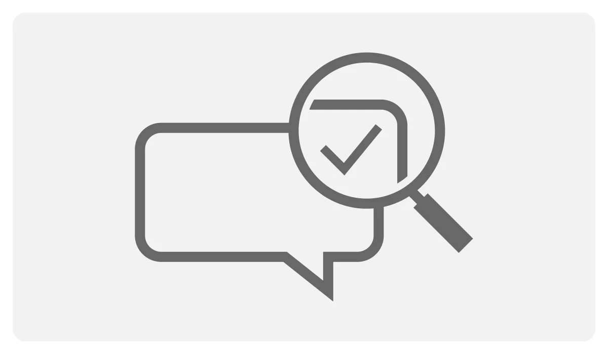 Icon of a speech bubble with a magnifying glass checking a tick mark, representing facilitating understanding and correction.